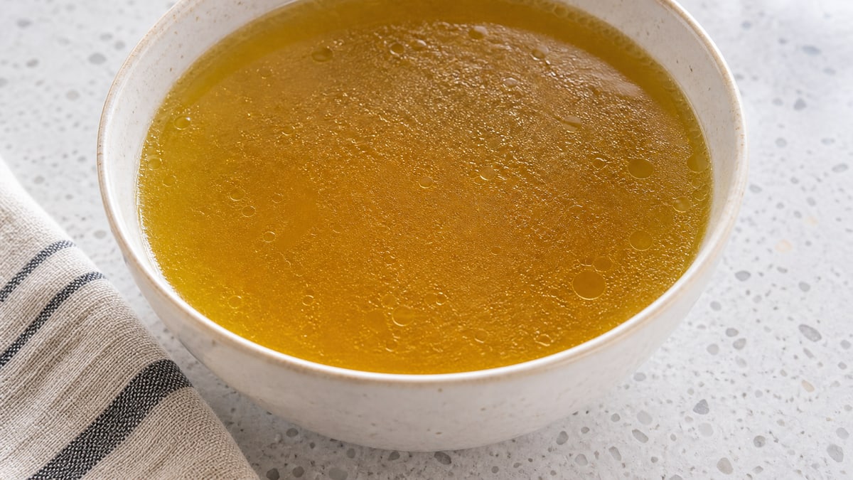 Chicken Stock, cooked and served. A generated image, not a photograph.