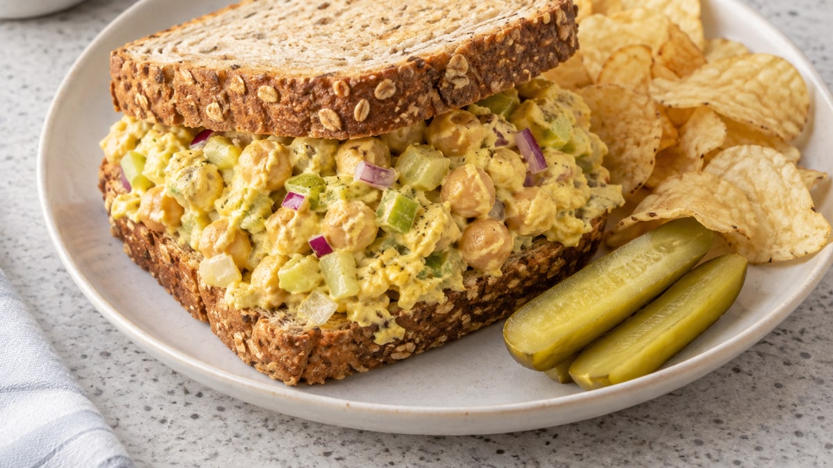 Curried Chickpea Salad Sandwiches, cooked and served. A generated image, not a photograph.