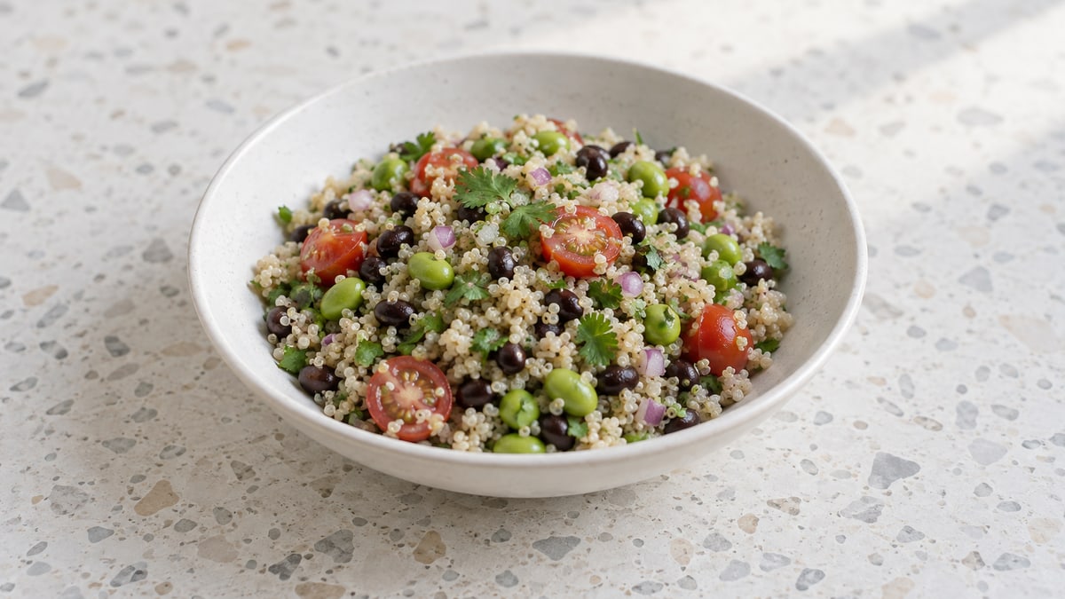 Edamame & Black Bean Quinoa Salad, cooked and served. A generated image, not a photograph.